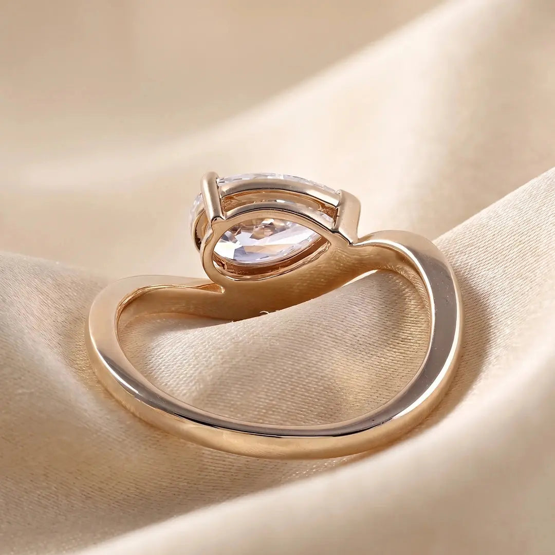 1.05 CT East West Pear Cut Diamond Curve Ring