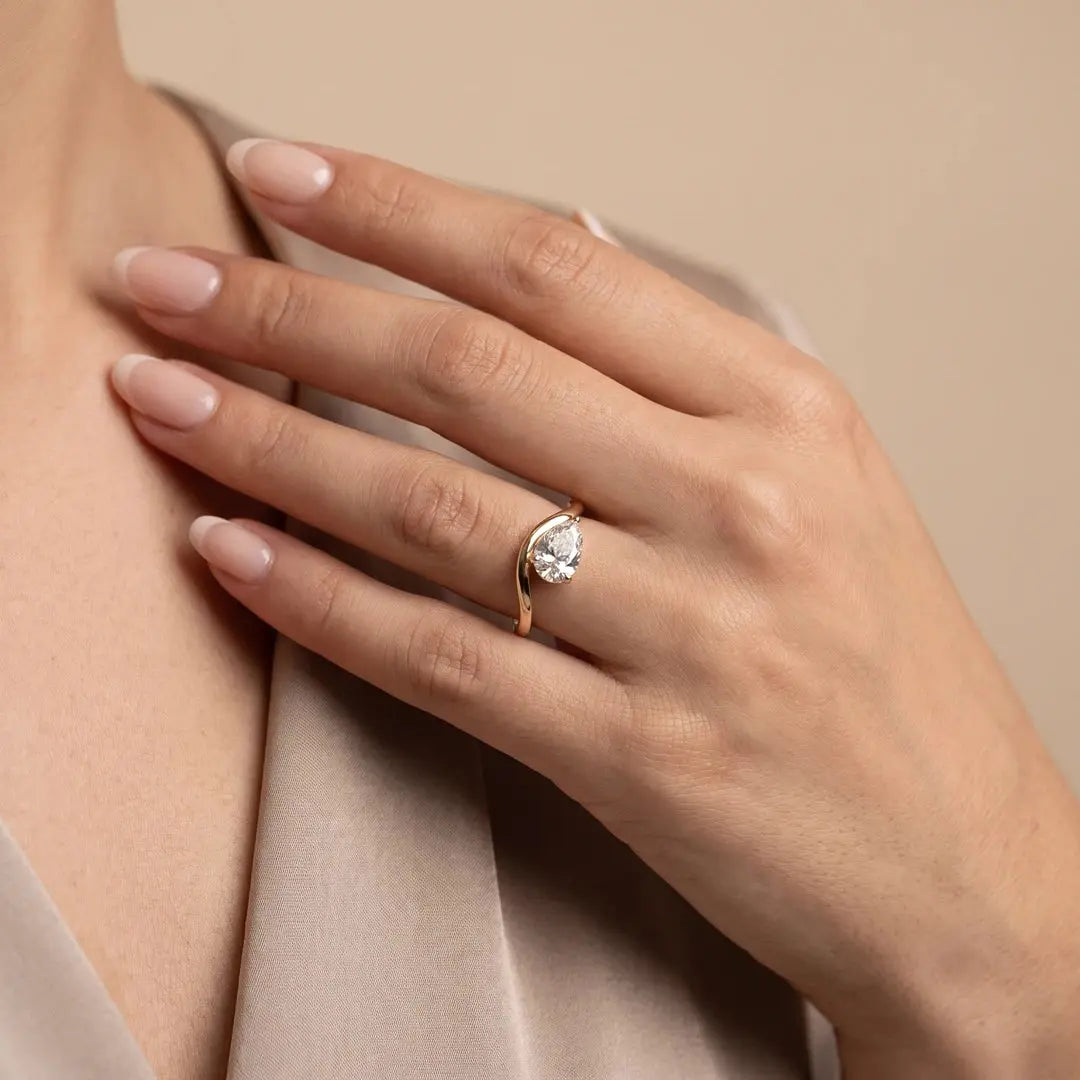 1.05 CT East West Pear Cut Diamond Curve Ring