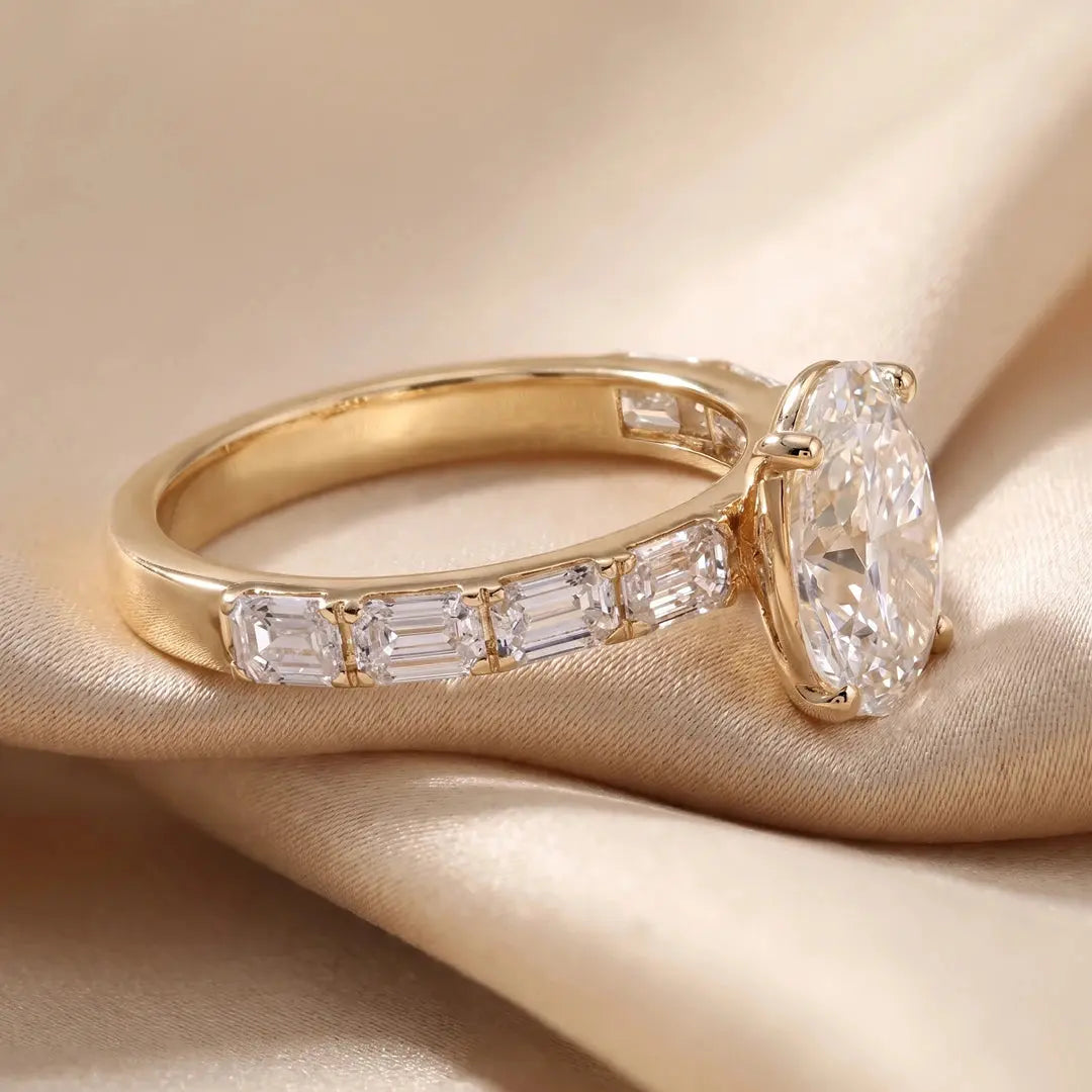3.25 CT Oval Cut Ring With East West Emerald Side Diamonds