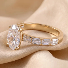 3.25 CT Oval Cut Ring With East West Emerald Side Diamonds