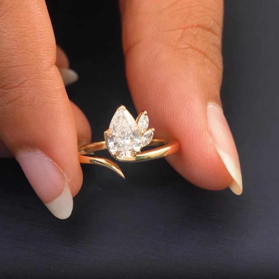 Handshot video of 1.15 CT Pear Vine Accent Diamond Ring