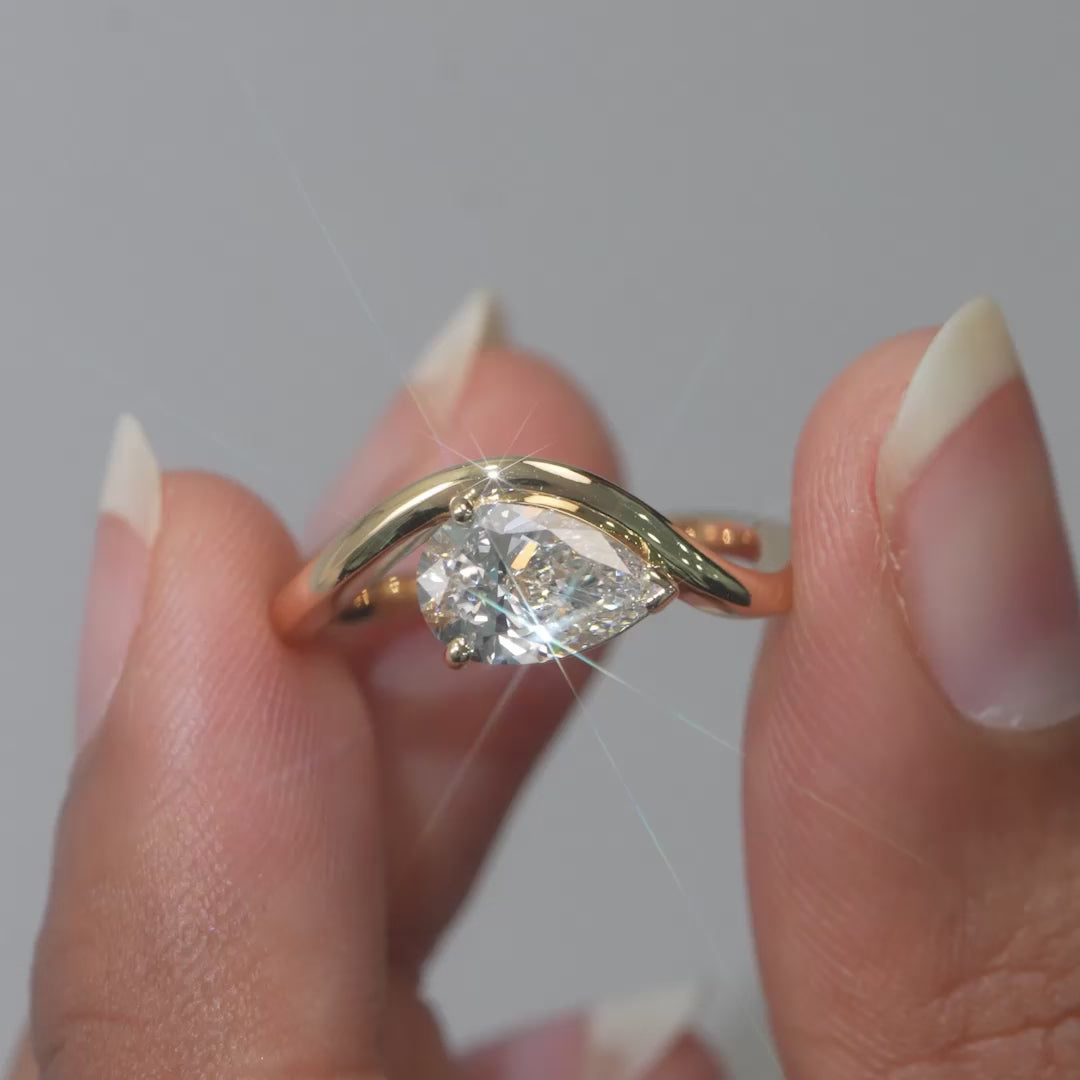 1.05 CT East West Pear Cut Diamond Curve Ring